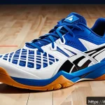 배구화 추천 - A high-performance volleyball shoe displayed on a polished indoor wooden court, featuring a breathab...